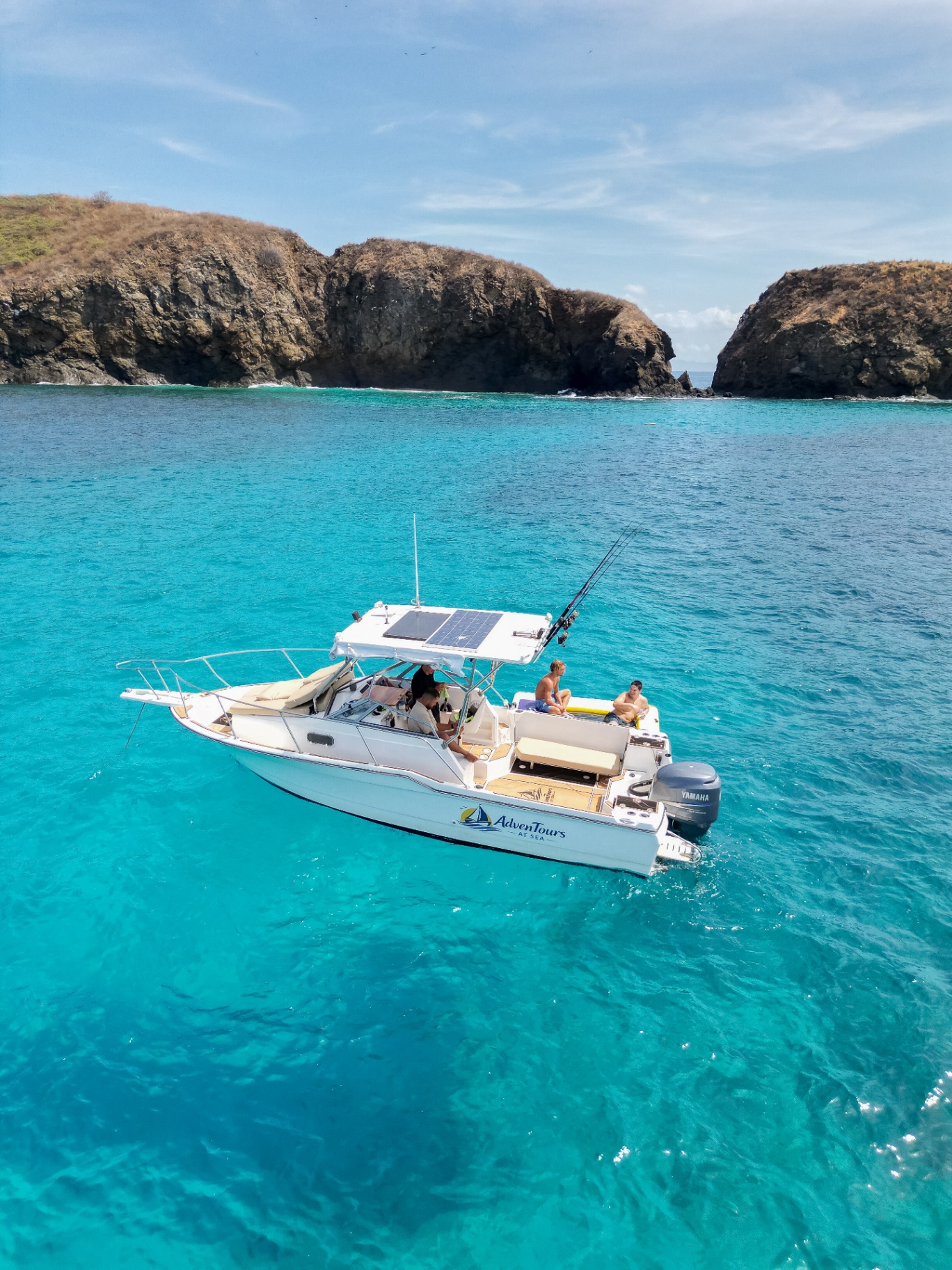 Adventours at Sea boat on turquoise water off Flamingo, Guanacaste, Costa Rica