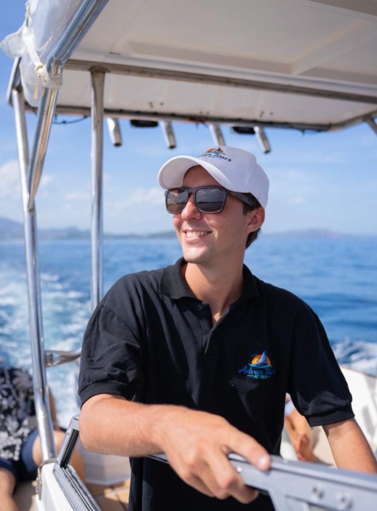 Captain Juan Ignacio Pescara at the helm of Adventours at Sea off Flamingo, Guanacaste