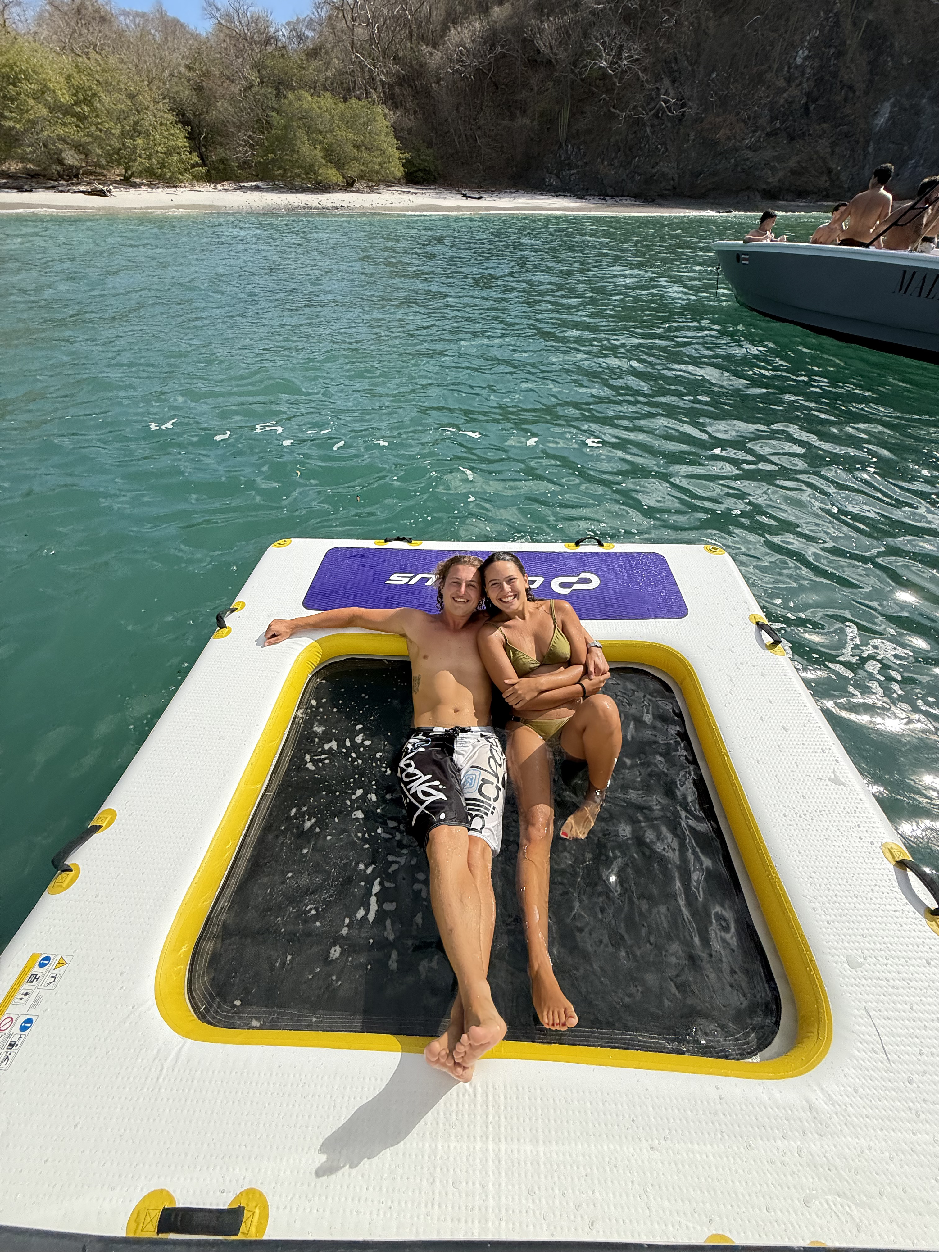 Guests on the inflatable floating deck during a private snorkel trip from Flamingo
