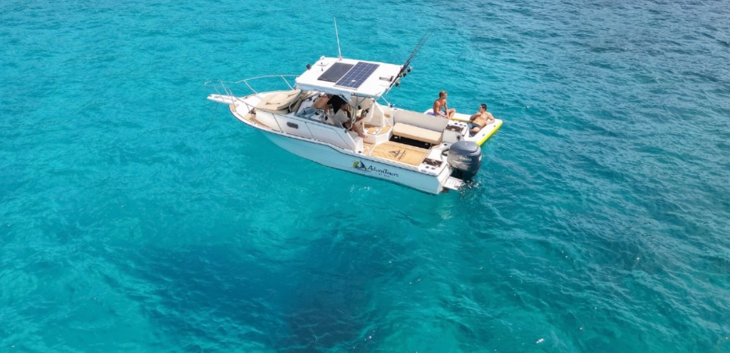 Aerial view of the Adventours at Sea boat on turquoise water off Flamingo, Guanacaste