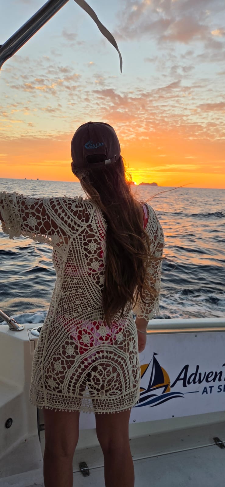 Guest watching sunset from Adventours at Sea off Playa Flamingo
