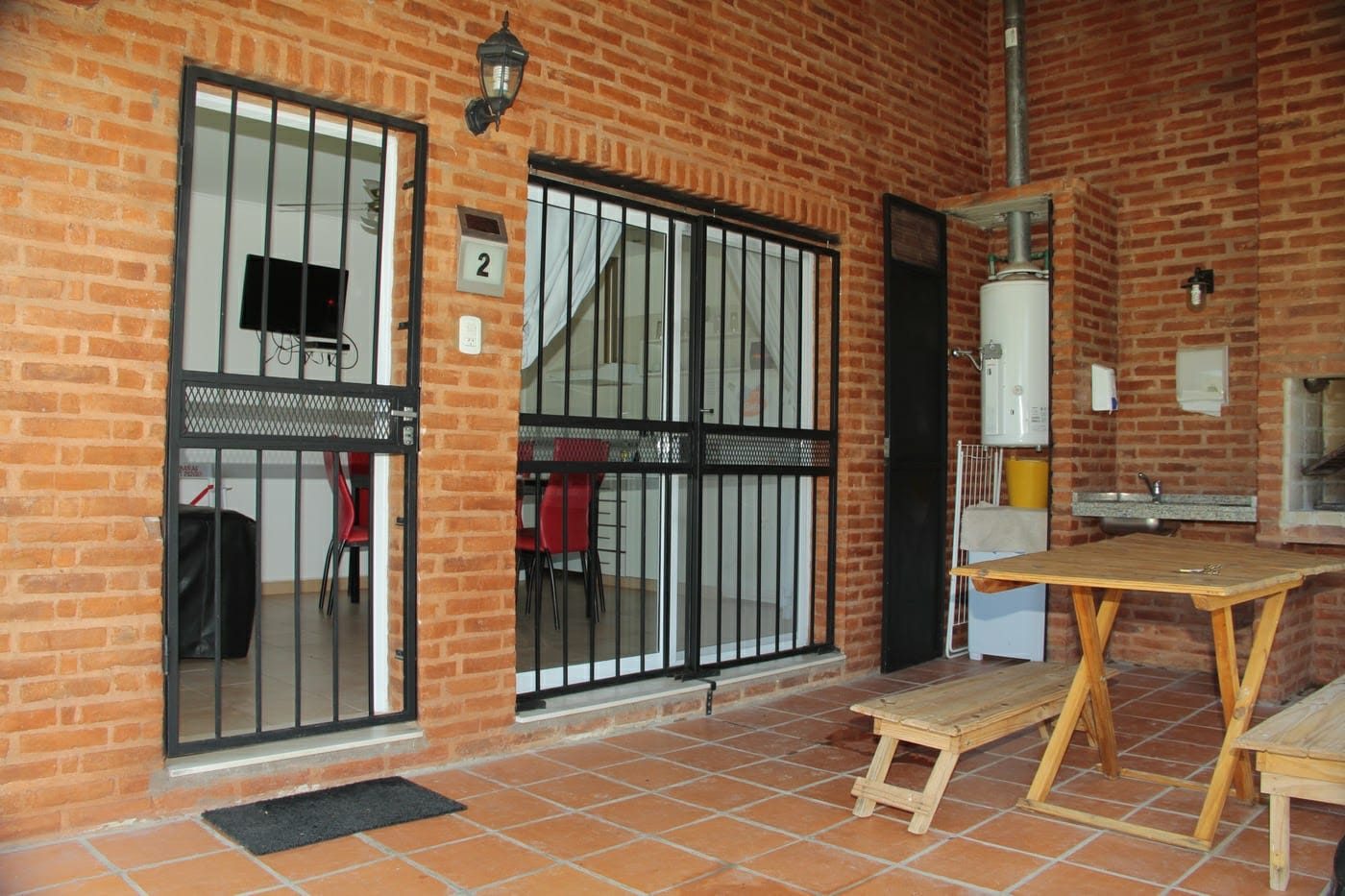 Parrilla individual y galería de cabaña